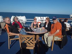 people seated at table on ship